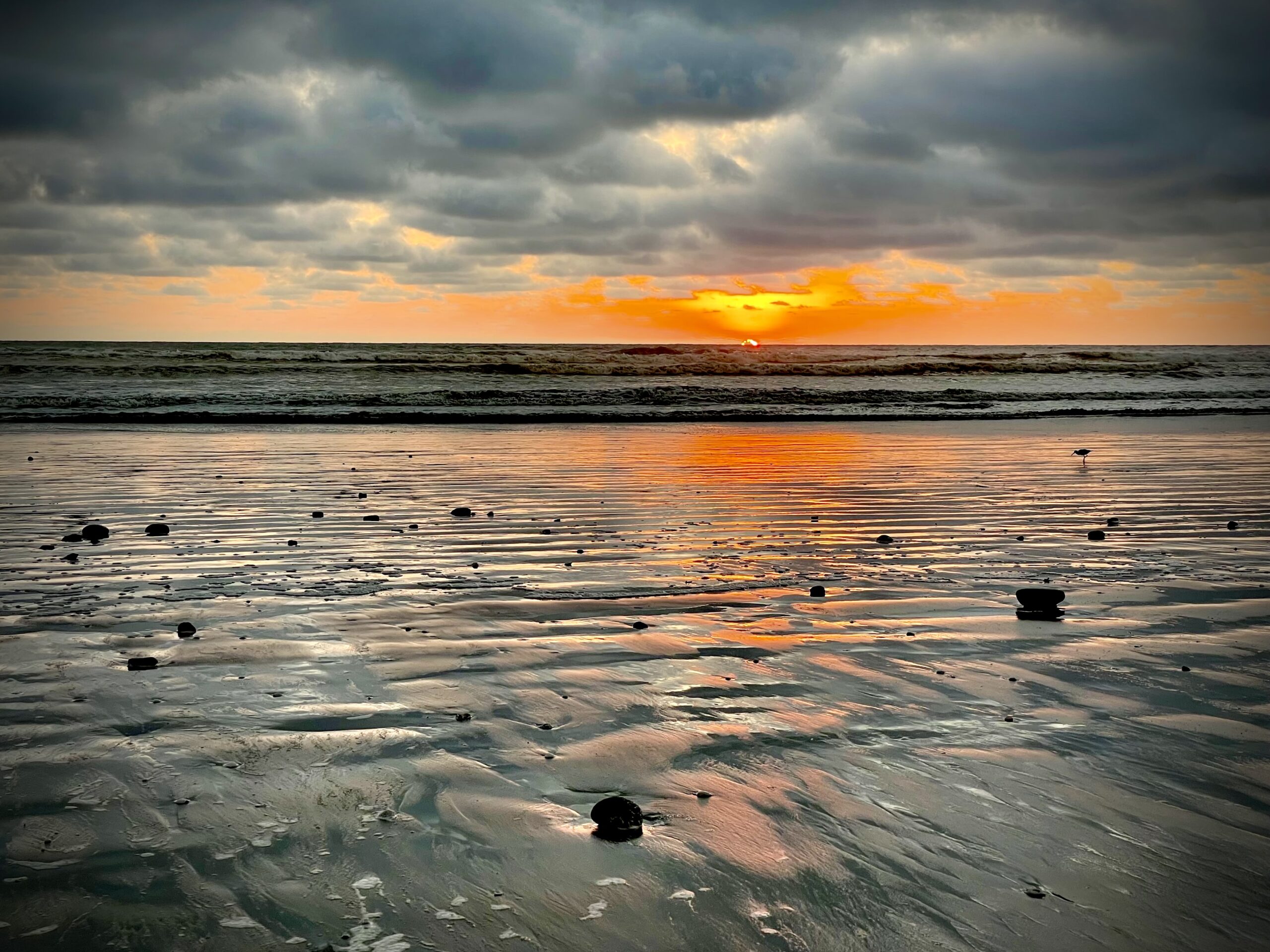 A beautiful sunset at low tide in Canoa
