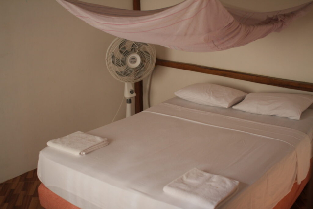 Private double room with mosquito net and fan